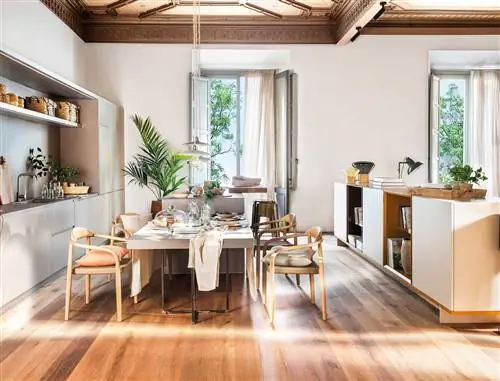 Современная кухня совмещена с гостиной с мебелью цвета хаки.