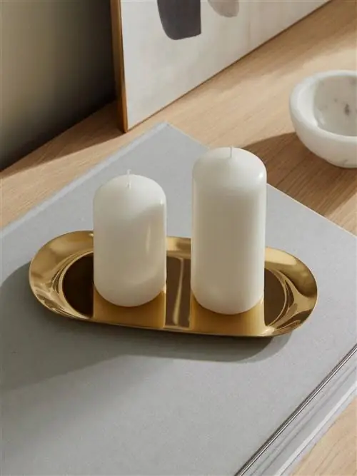 Золотистый карман-пустышка овальной формы от Westwing.