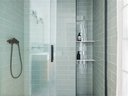 ванная комната с душевой кабиной и синей плиткой в стиле метро