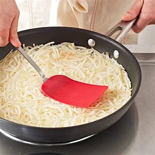 Лопатка для кастрюли с коричневой коричневой крошкой сплющить