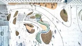Он расположен на участке, окруженном историческими зданиями города от ар-деко до баухасовских традиций