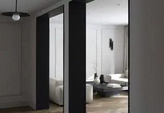 В распределителе светильник модели Tempo от Vibia, а в гостиной диван NeoWall от Living Divani и журнальные столики…