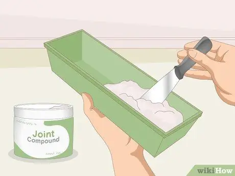 Отремонтируйте ленту для гипсокартона, отделяющуюся от стен Шаг 2