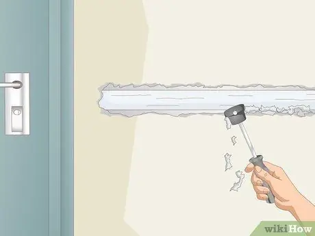 Отремонтируйте ленту для гипсокартона, отделяющуюся от стен Шаг 7