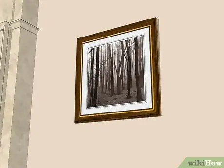Вешать картины на гипсовые стены Шаг 5