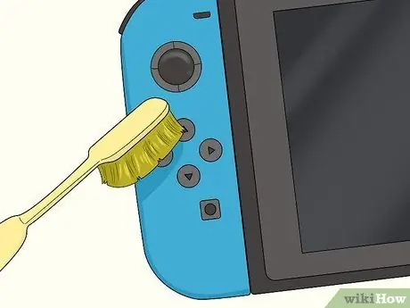 Очистите кнопки Joy Con, шаг 3