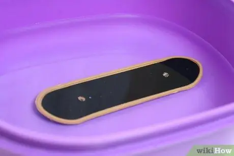 Снимите Griptape с технической колоды Шаг 9