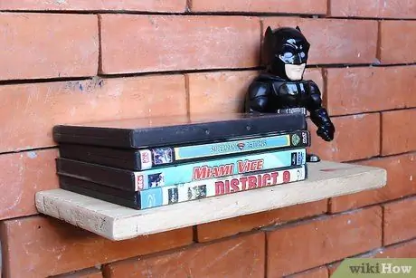 Храните DVD в небольшом пространстве Шаг 2