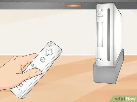 Синхронизируйте Wii Remote с консолью Шаг 6