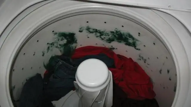 Где находится ловушка для ворса на стиральной машине Whirlpool с верхней загрузкой?